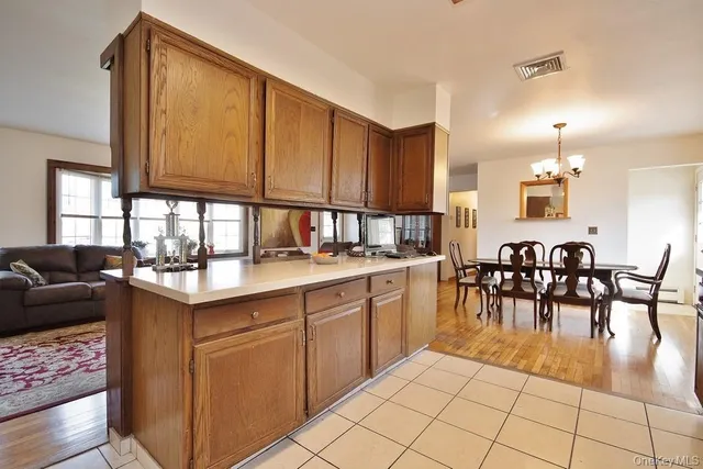 a open kitchen with stainless steel appliances granite countertop a stove top oven a sink and cabinets