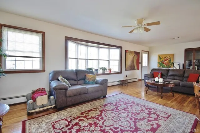 a living room with furniture and a window