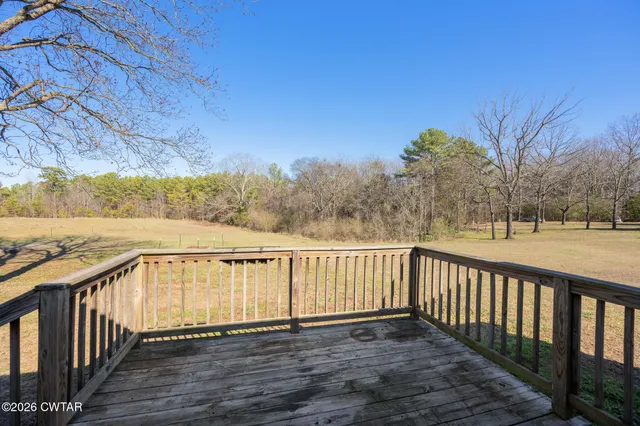 a view of a balcony with wooden fence