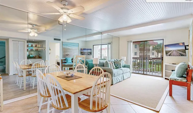 a view of a dining room with furniture window and outside view