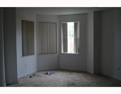 14920 Southwest 21st Terrace Miami, FL 33185 - Photo 6 of 8 a view of an empty room with a window