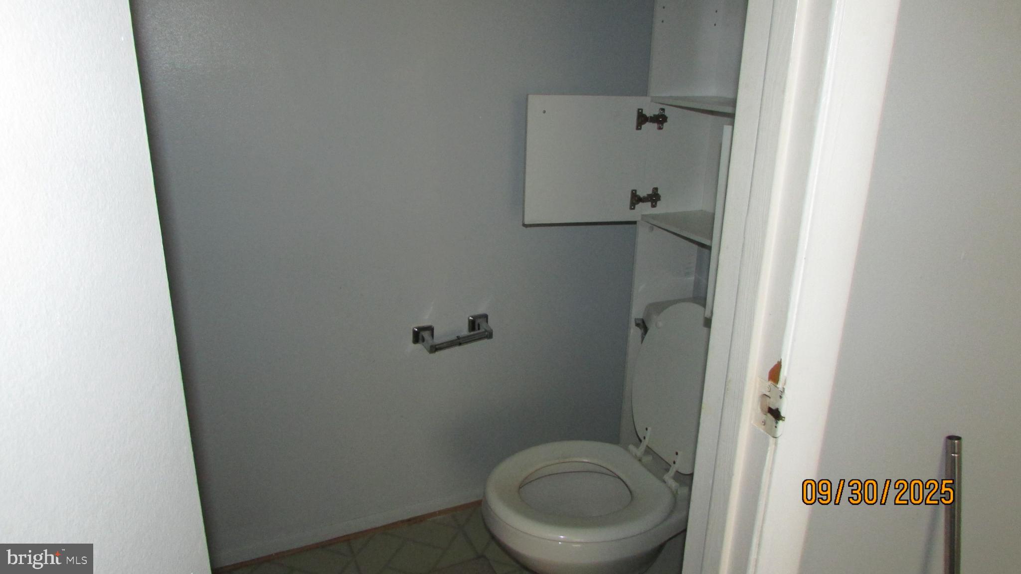 4805 Berwyn House Road, Unit A4805 College Park, MD 20740 - Photo 9 of 17 a bathroom with a granite countertop toilet and a sink