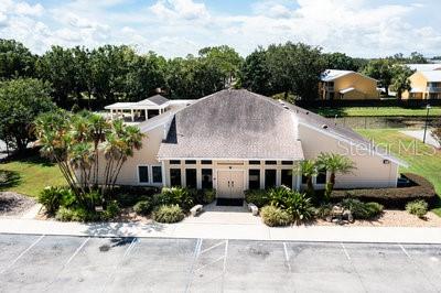 2025 Sylvester Road, Unit N202 Lakeland, FL 33803 - Photo 21 of 29 a front view of a house with garden