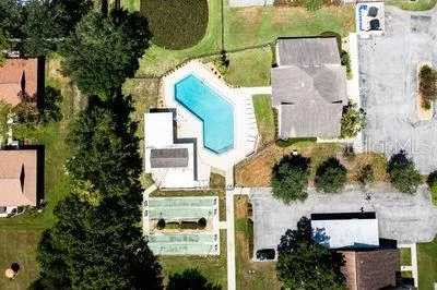 an aerial view of residential houses with outdoor space