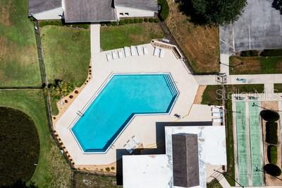 2025 Sylvester Road, Unit N202 Lakeland, FL 33803 - Photo 28 of 29 an aerial view of a house with a garden and trees