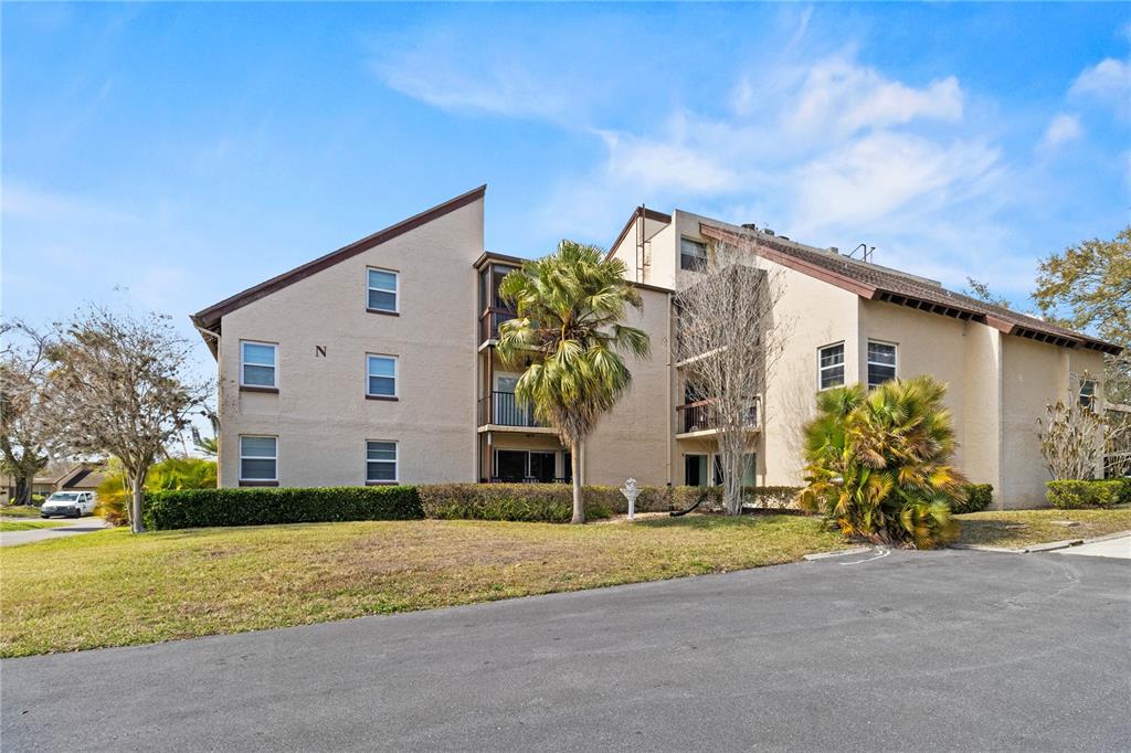2025 Sylvester Road, Unit N202 Lakeland, FL 33803 - Photo 29 of 29 a view of a house with a yard and large tree