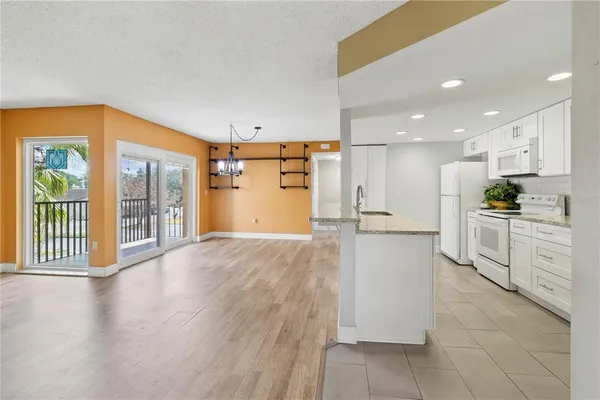 a view of a kitchen with a sink and cabinets