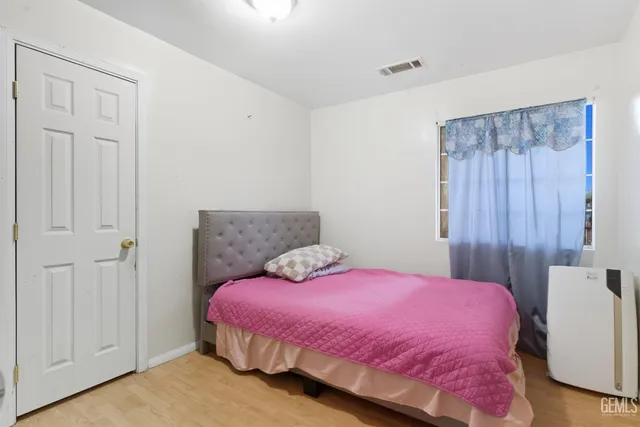 a bedroom with a bed and a closet