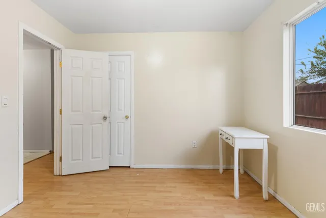 a view of a room with a table and chairs