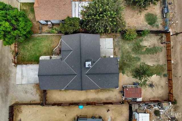 an aerial view of a house with outdoor space