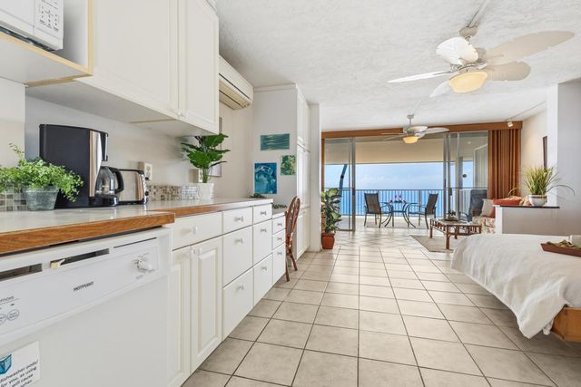 a kitchen with cabinets and appliances