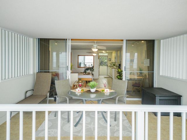 a room with dining table and chairs