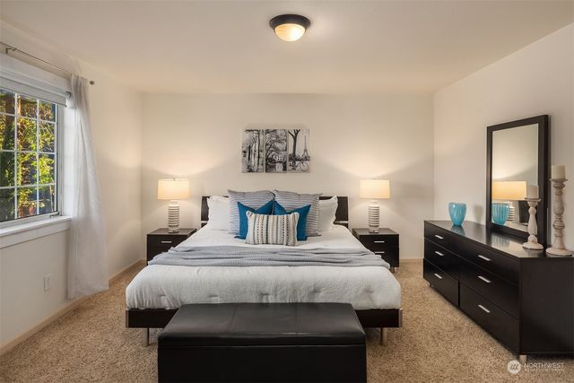 a bedroom with a bed and a dresser