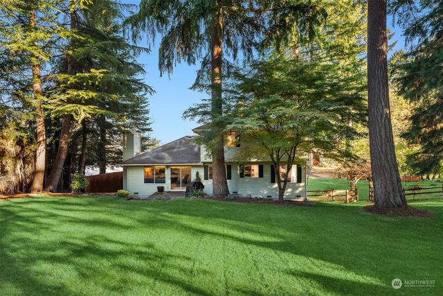 a view of house with a garden