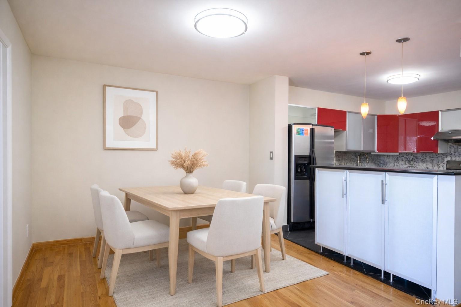 7124 164th Street, Unit 2 Queens, NY 11365 - Photo 8 of 22 a dining room with furniture and wooden floor