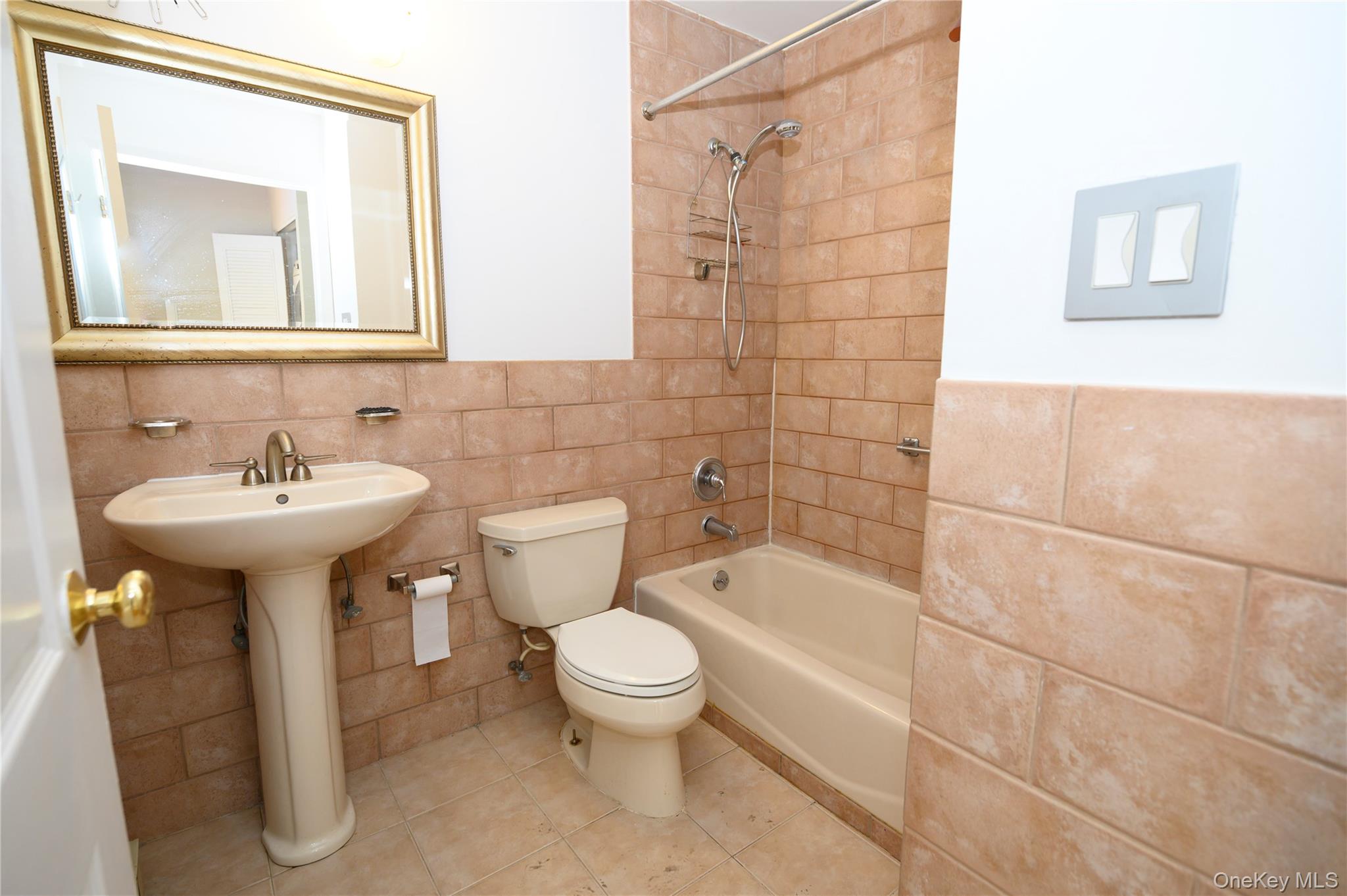 7124 164th Street, Unit 2 Queens, NY 11365 - Photo 10 of 22 a bathroom with a sink toilet and shower