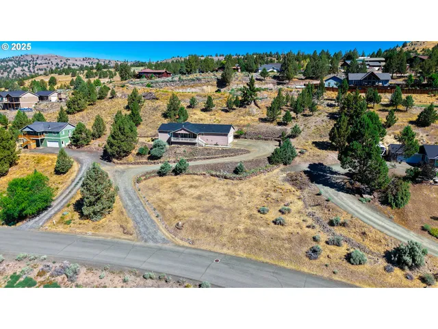 a view of a city with mountains in the background