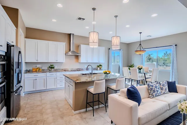 a bathroom with a bathtub double vanity sink and a mirror