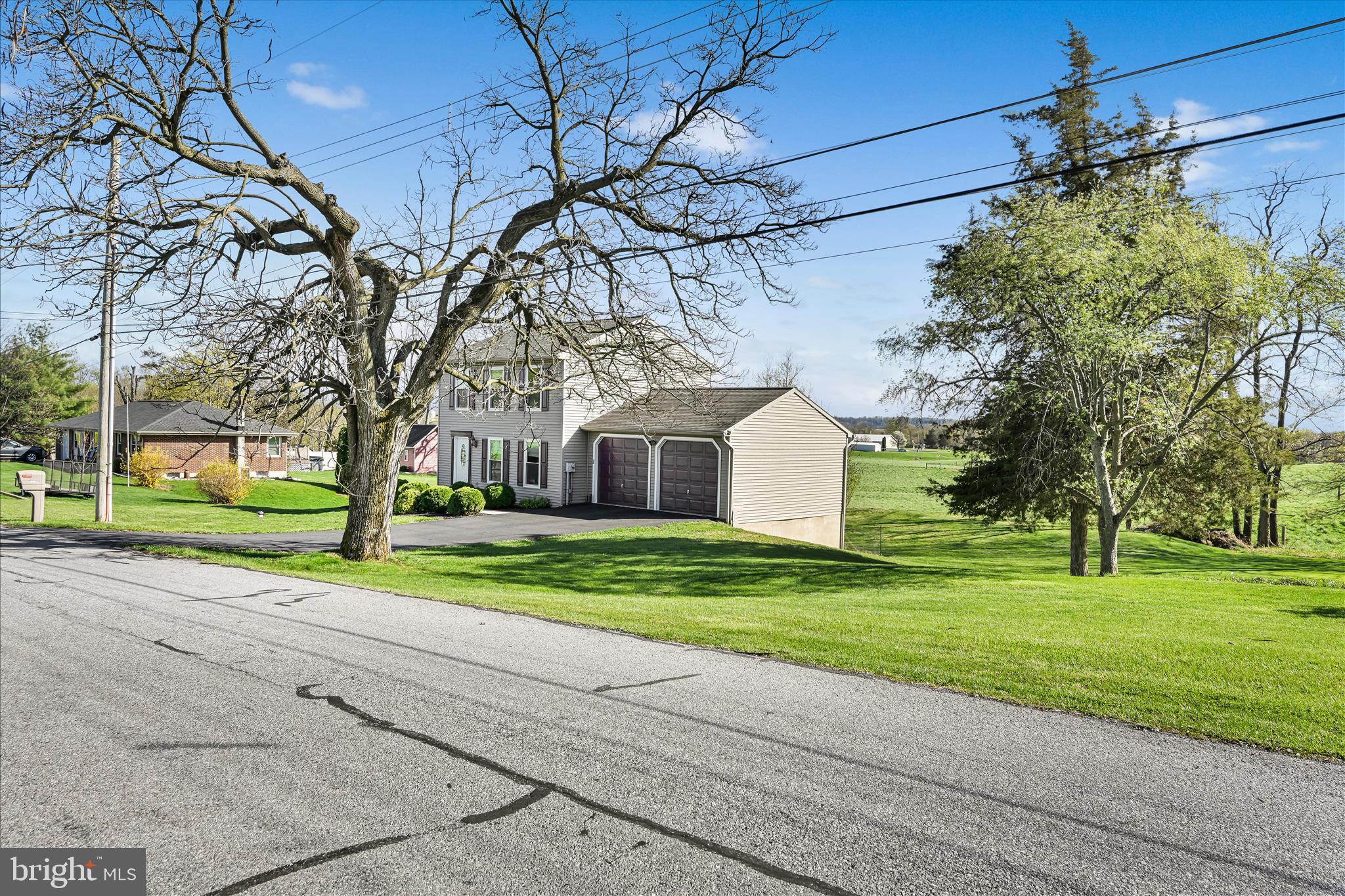 4285 Highland Road Elizabethtown, PA 17022 - Photo 4 of 39 a view of a house with a big yard and large tree