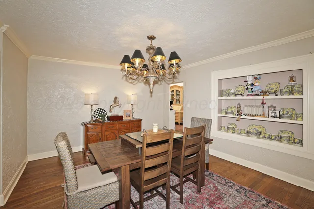 a kitchen with stainless steel appliances granite countertop a sink refrigerator and cabinets