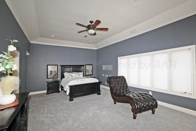 a bed room with a bed and a chandelier