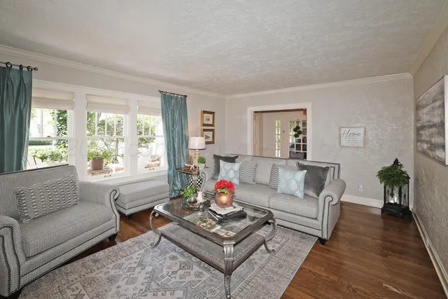 a living room with furniture and a fireplace