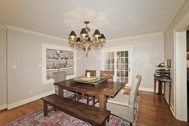 a kitchen with granite countertop a sink stove and cabinets