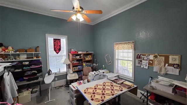 a bedroom with a workspace