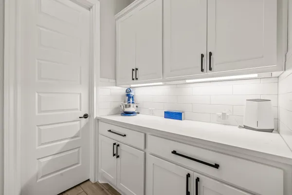 a bathroom with a double vanity sink and mirror