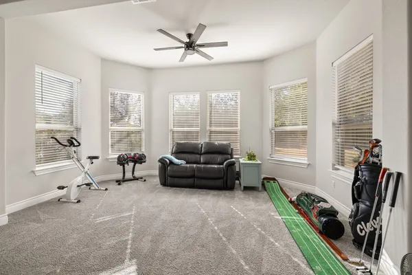a bedroom with a bed dresser and a window