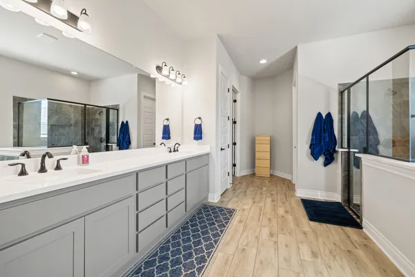 a bathroom with a sink toilet and shower