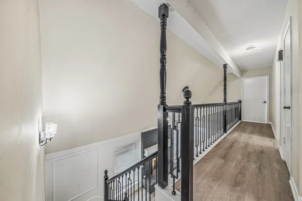 a view of a hallway with stairs