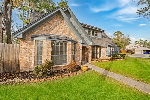 a view of an house with backyard porch and sitting area