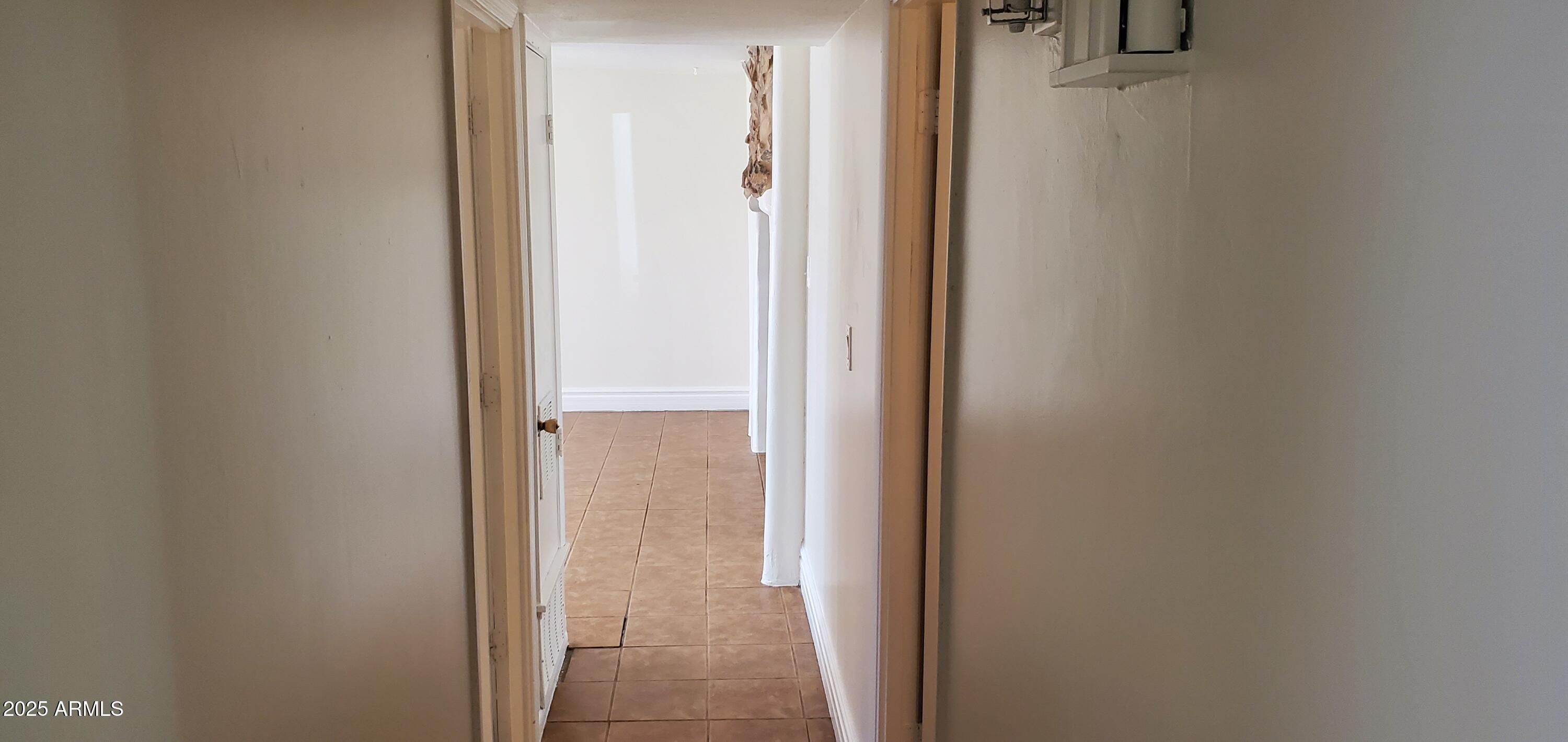 1609 North 47th Drive Phoenix, AZ 85035 - Photo 8 of 16 8 Alley to Living room view