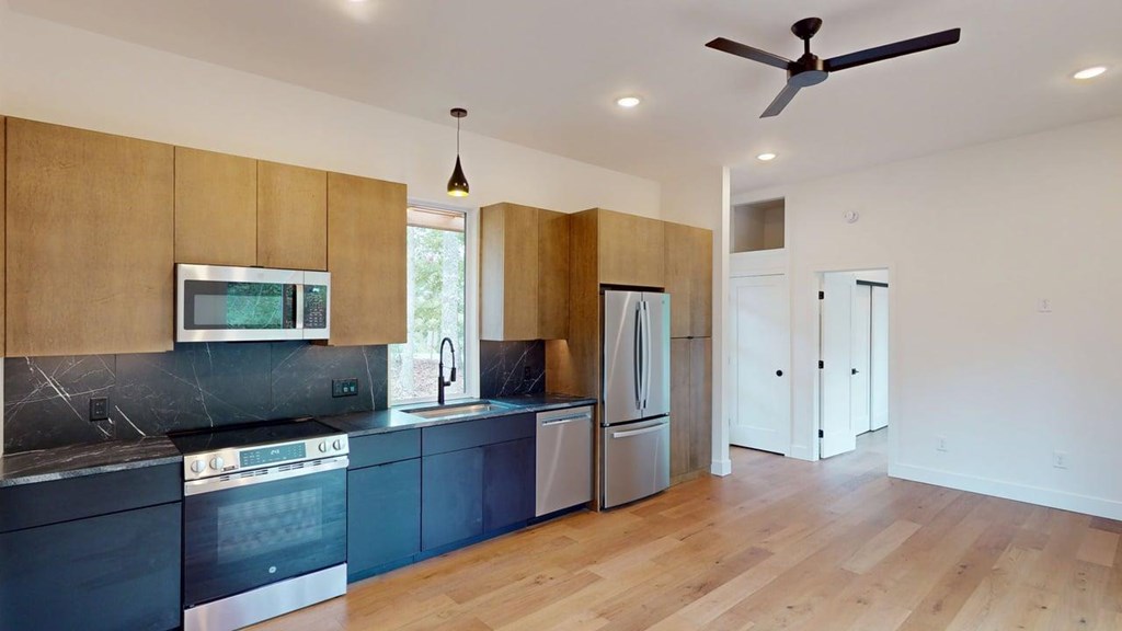 433 Brannon Ridge Young Harris, GA 30582 - Photo 4 of 13 a kitchen with stainless steel appliances granite countertop a refrigerator and a sink