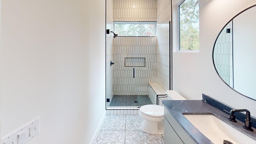 433 Brannon Ridge Young Harris, GA 30582 - Photo 10 of 13 a bathroom with a granite countertop toilet a sink and a mirror