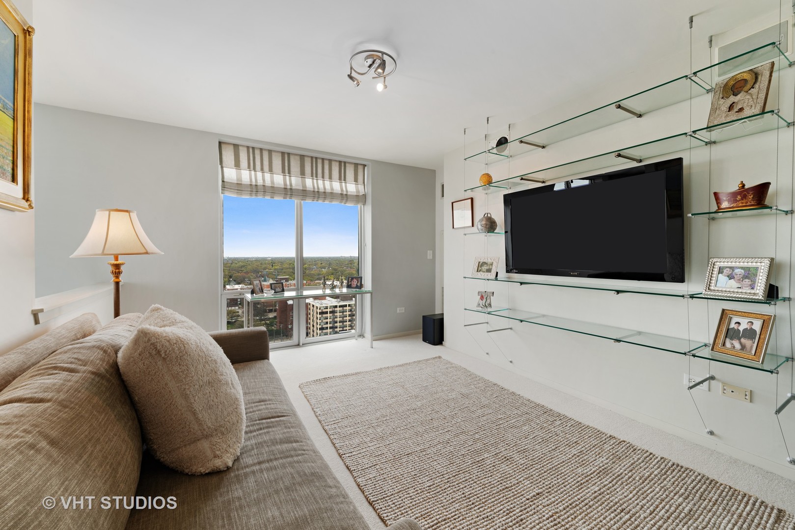1640 Maple Avenue, Unit 1606 Evanston, IL 60201 - Photo 12 of 40 a spacious bedroom with a bed and a flat screen tv
