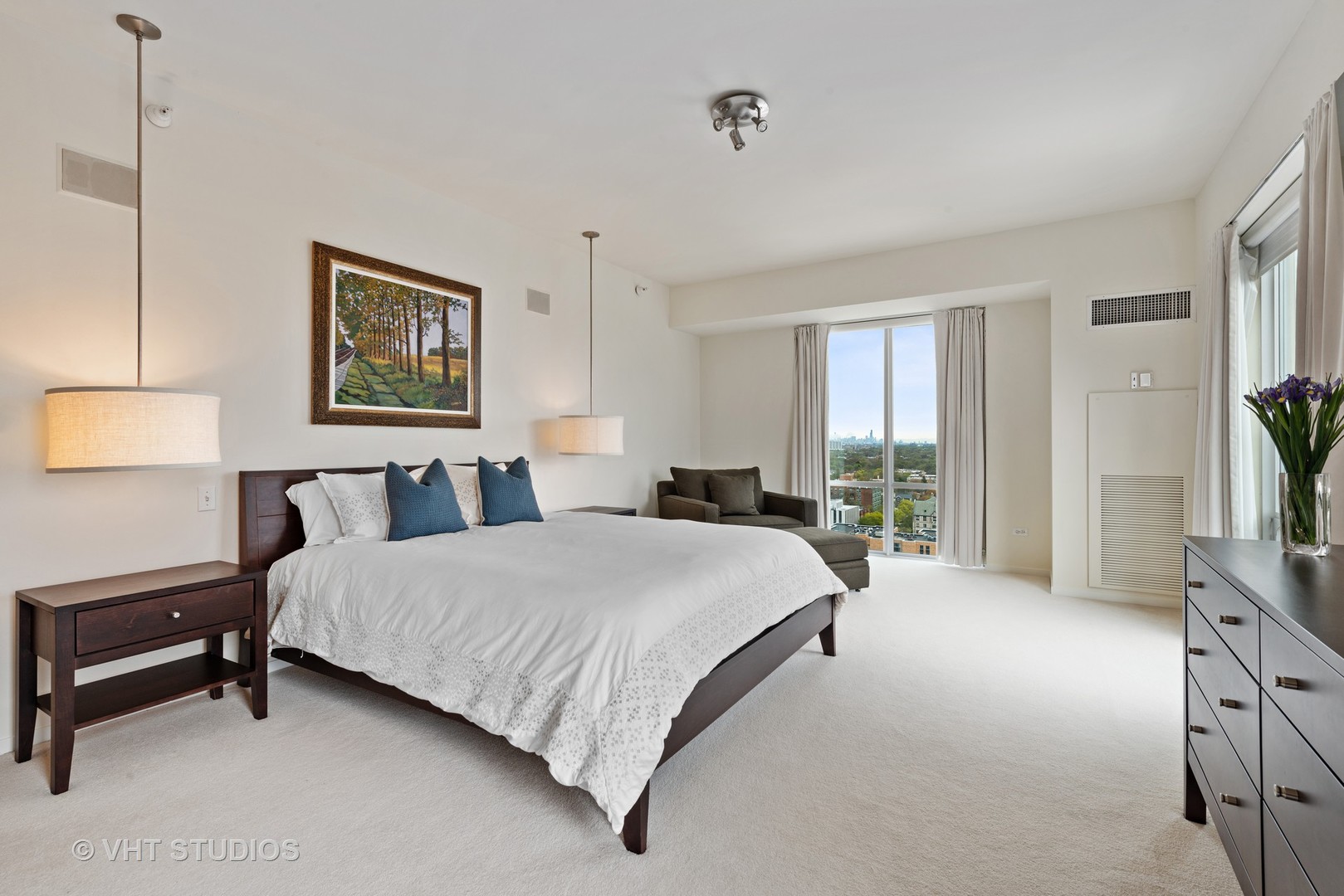 1640 Maple Avenue, Unit 1606 Evanston, IL 60201 - Photo 14 of 40 a spacious bedroom with a bed a couch and a flat tv screen