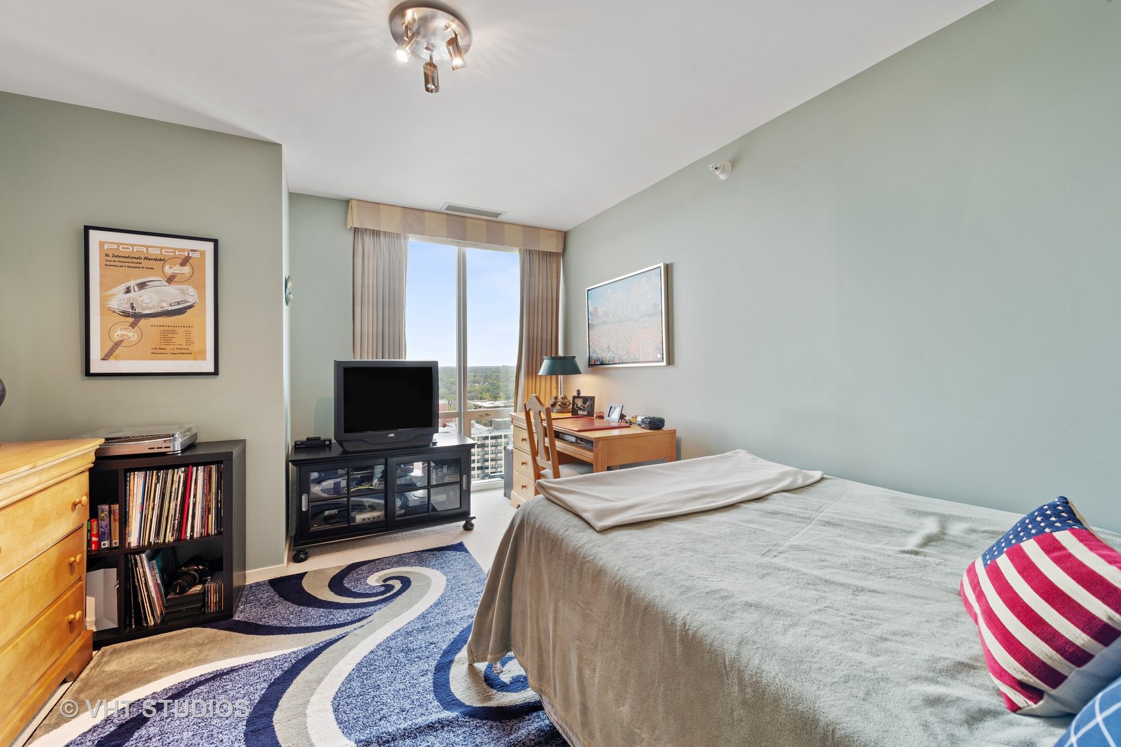 1640 Maple Avenue, Unit 1606 Evanston, IL 60201 - Photo 19 of 40 a bedroom with bed and a flat screen tv