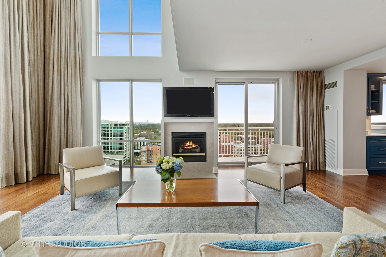 1640 Maple Avenue, Unit 1606 Evanston, IL 60201 - Photo 3 of 40 a living room with fireplace furniture and a large window