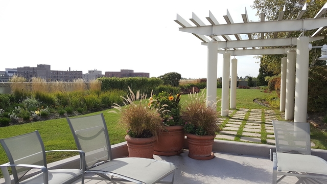 1640 Maple Avenue, Unit 1606 Evanston, IL 60201 - Photo 34 of 40 a view of a chairs and table in patio with potted plants