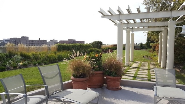 1640 Maple Avenue, Unit 1606 Evanston, IL 60201 - Photo 38 of 40 a view of a chairs and table in patio with potted plants