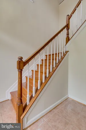 a view of staircase with wooden floor and stairs