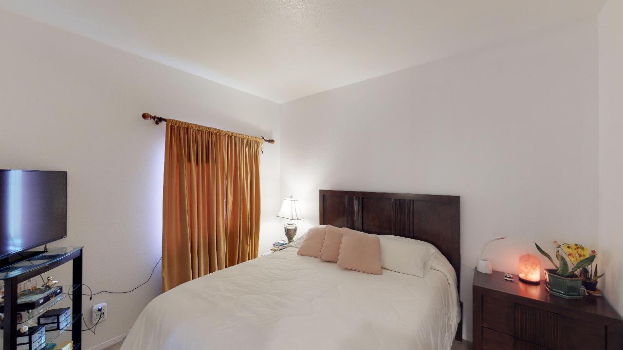 6374 Manzanita Way Riverside, CA 92504 - Photo 14 of 41 a bedroom with a bed and a flat screen tv