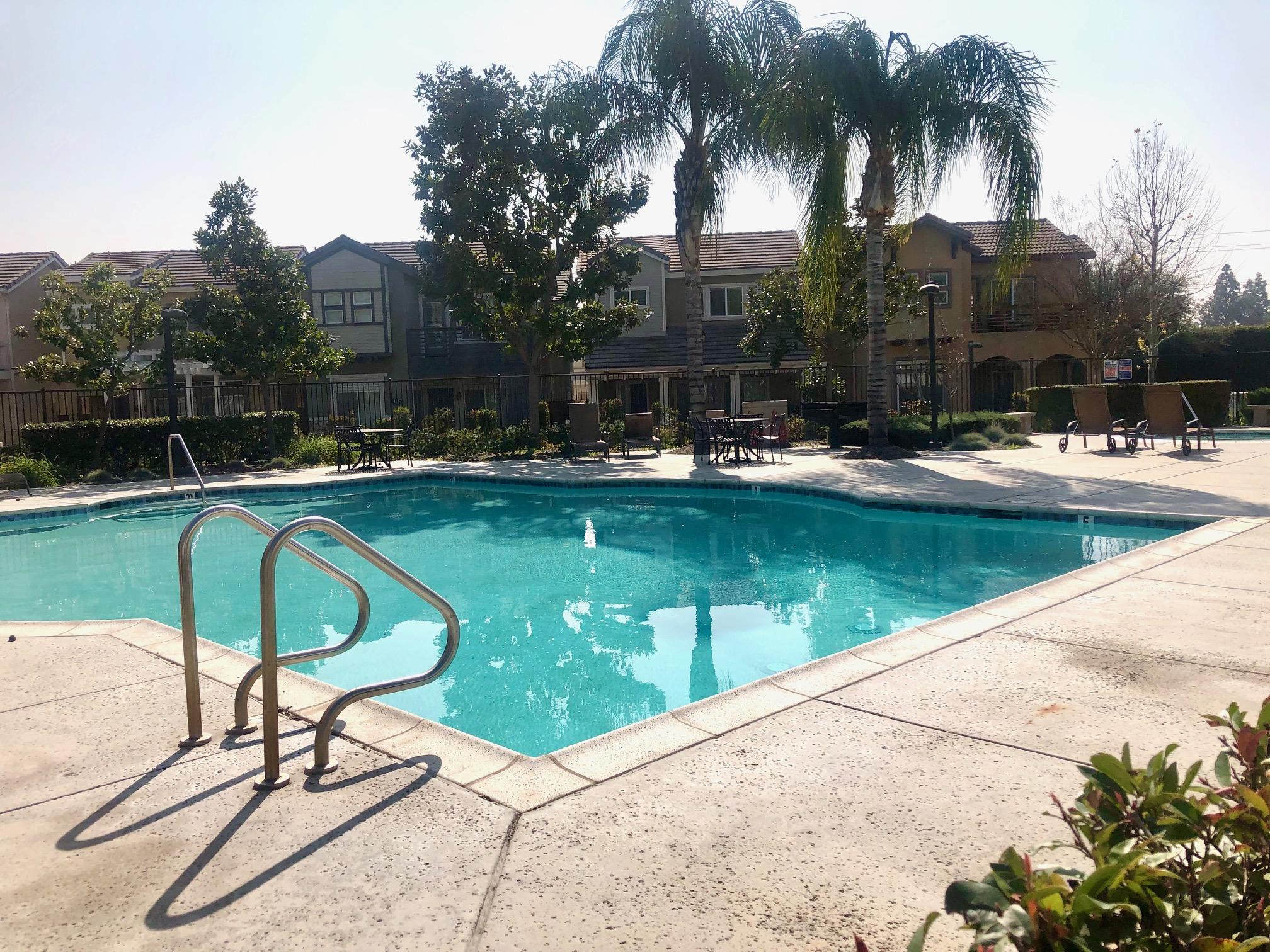 6374 Manzanita Way Riverside, CA 92504 - Photo 4 of 41 a swimming pool with outdoor seating and yard