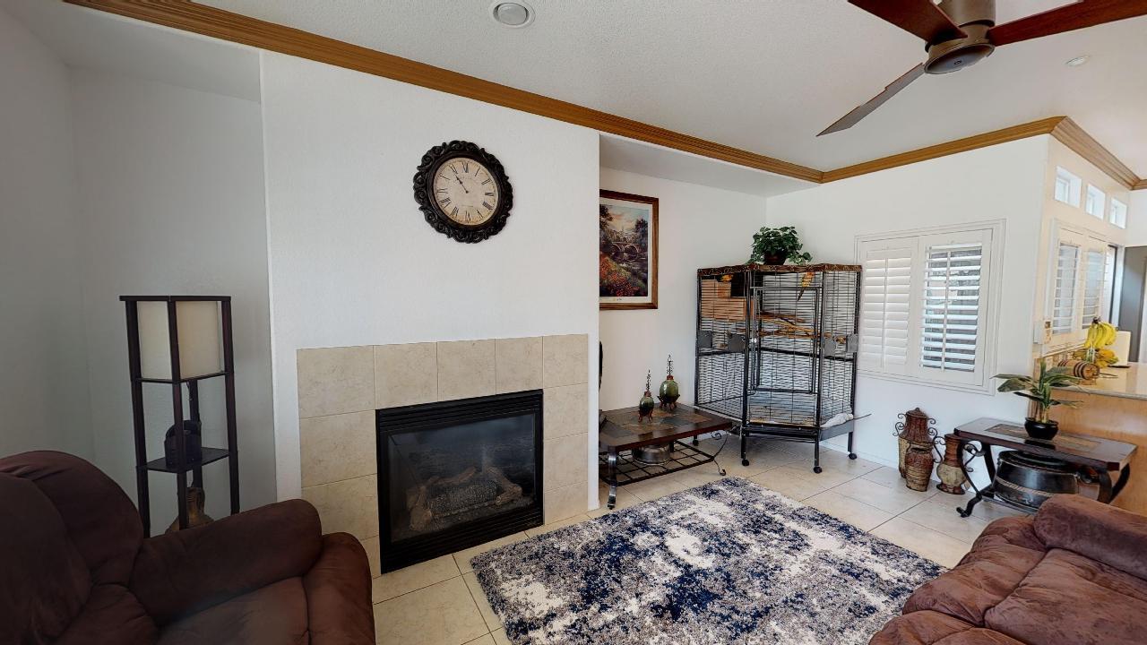 6374 Manzanita Way Riverside, CA 92504 - Photo 36 of 41 a living room with furniture a rug and a fireplace