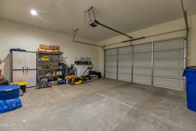 a view of a garage with rack and bicycle