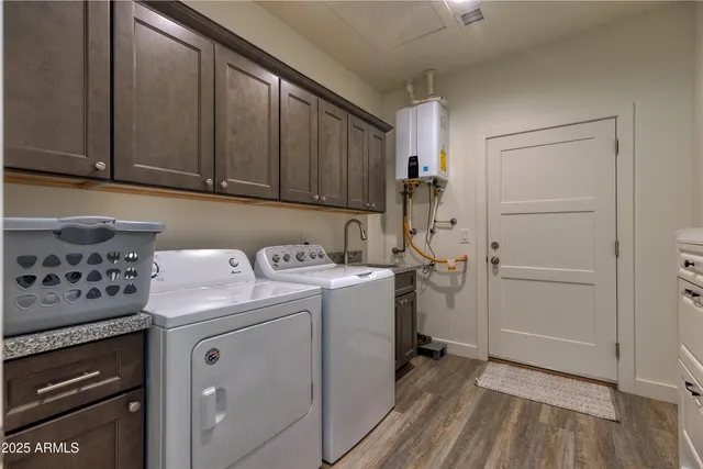 a view of storage and utility room with washer and dryer