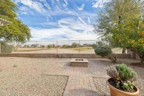 a view of a terrace with yard and mountain view in back