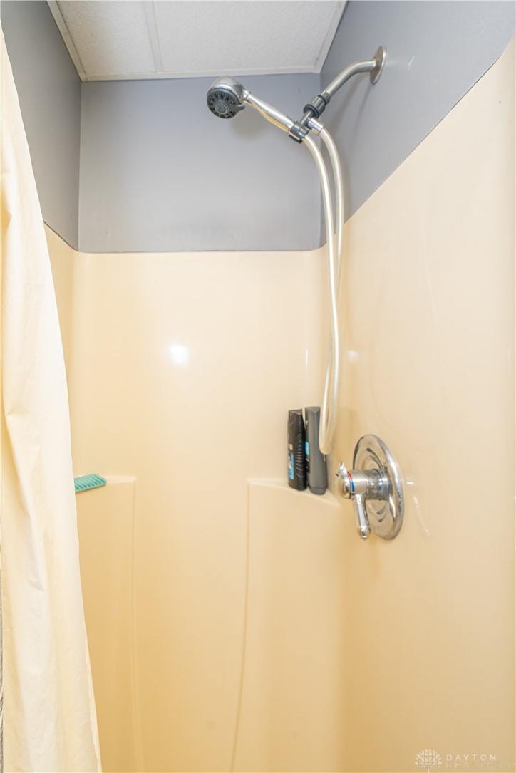 10584 New Biddinger Road Harrison, OH 45030 - Photo 28 of 61 This shower features a handheld showerhead, perfect for flexible bathing.